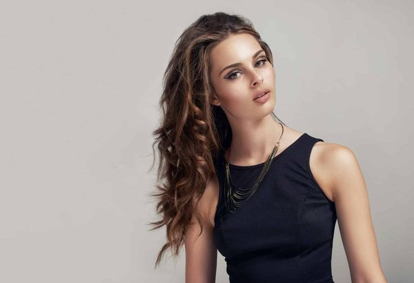 How can you style a mini skirt for a sophisticated look?